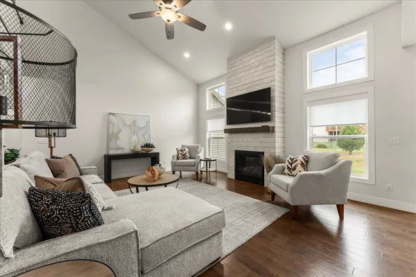 a living room with furniture fireplace and a flat screen tv