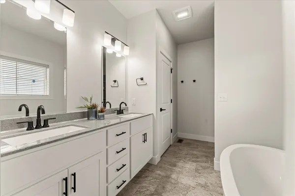 a bathroom with a toilet a sink and a mirror