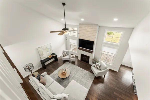 a living room with furniture and a potted plant