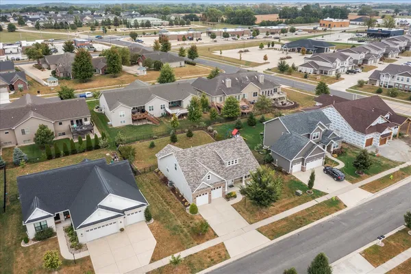 an aerial view of residential houses with outdoor space