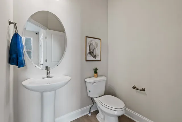 a view of a hallway view with wooden floor and living room