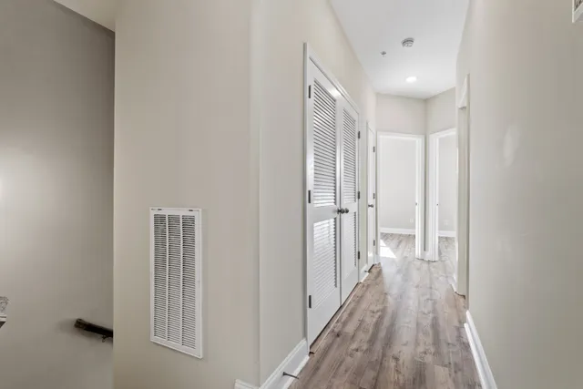 a bedroom with a bed and a table in it