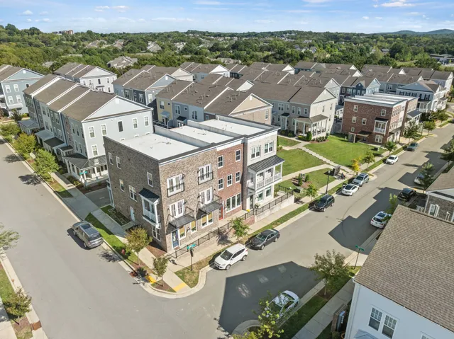 an aerial view of a city with lots of residential buildings