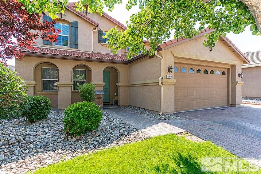 11190 Messina Way Reno, NV 89521 - Photo 1 of 21 a front view of a house with a yard and garage