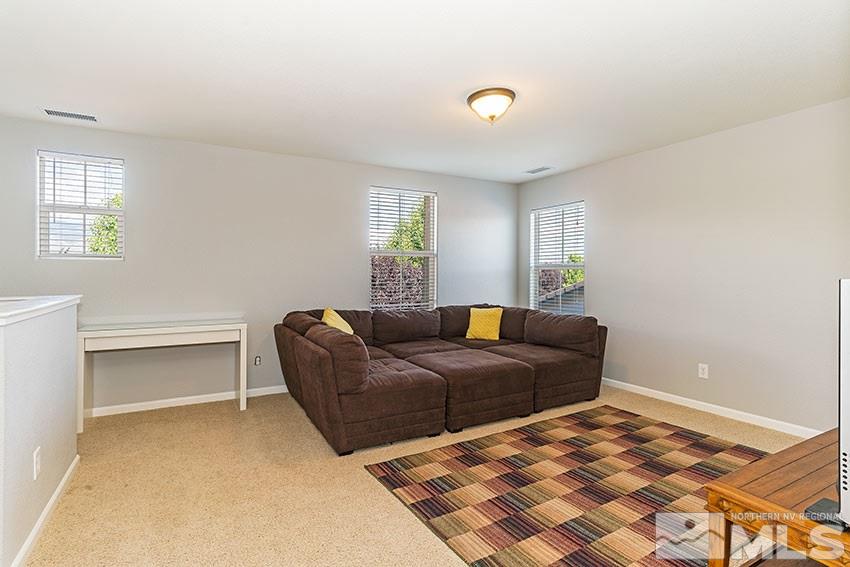 11190 Messina Way Reno, NV 89521 - Photo 18 of 21 a living room with a bed furniture and a window