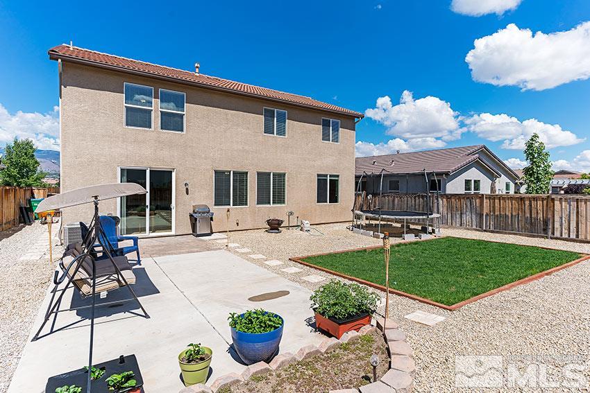 11190 Messina Way Reno, NV 89521 - Photo 20 of 21 a view of a house with backyard sitting area and swimming pool