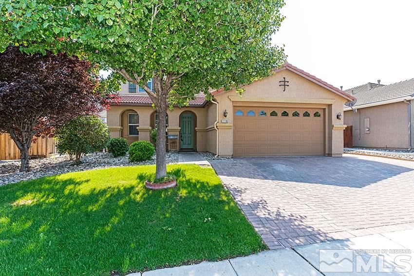 11190 Messina Way Reno, NV 89521 - Photo 2 of 21 a front view of a house with a yard and garage