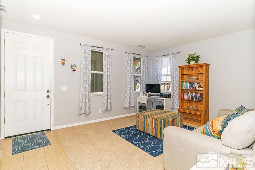 11190 Messina Way Reno, NV 89521 - Photo 3 of 21 a living room with furniture and a flat screen tv