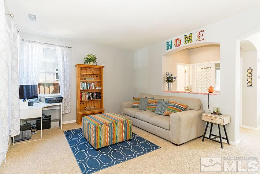 11190 Messina Way Reno, NV 89521 - Photo 4 of 21 a living room with furniture and a couch