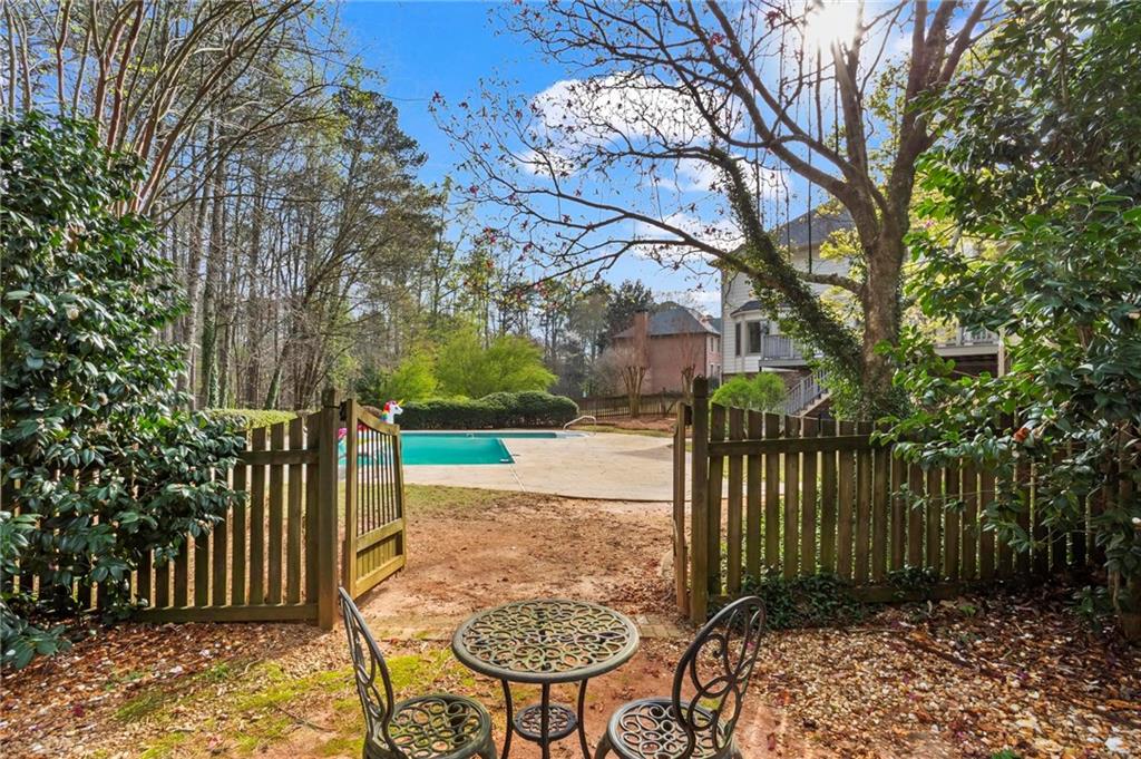4350 Fallowfield Lane Southwest Lilburn, GA 30047 - Photo 51 of 64 a view of a backyard with garden