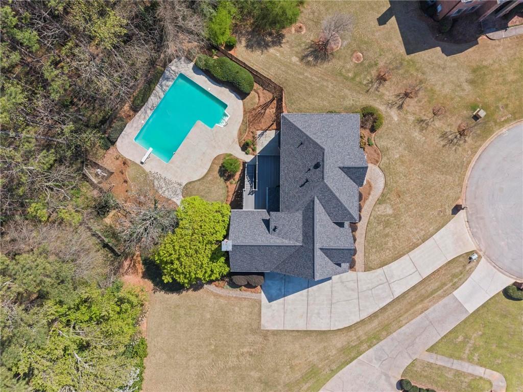 4350 Fallowfield Lane Southwest Lilburn, GA 30047 - Photo 52 of 64 an aerial view of a house with a yard and a large tree