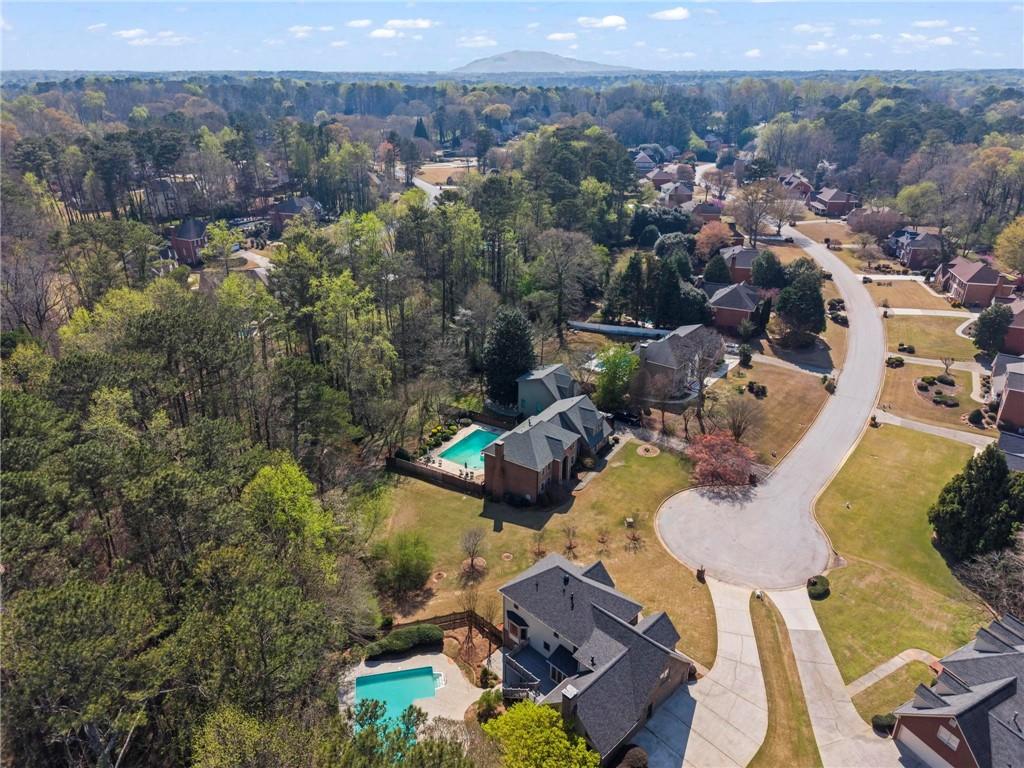 4350 Fallowfield Lane Southwest Lilburn, GA 30047 - Photo 53 of 64 an aerial view of a house with a mountain