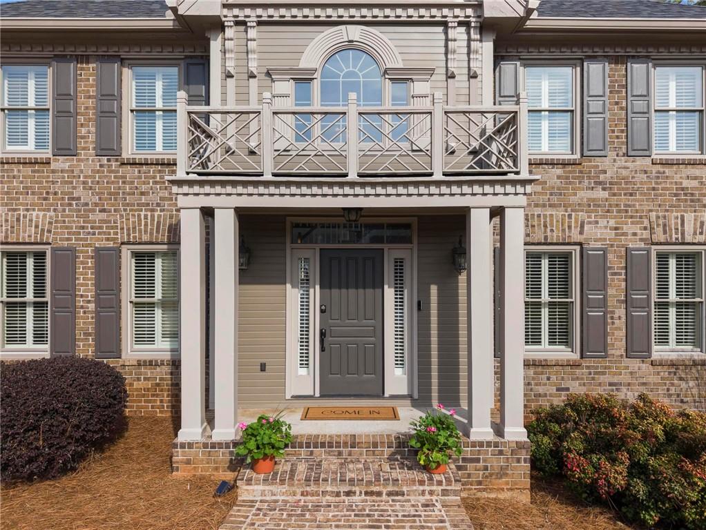 4350 Fallowfield Lane Southwest Lilburn, GA 30047 - Photo 6 of 64 a front view of a house with garden