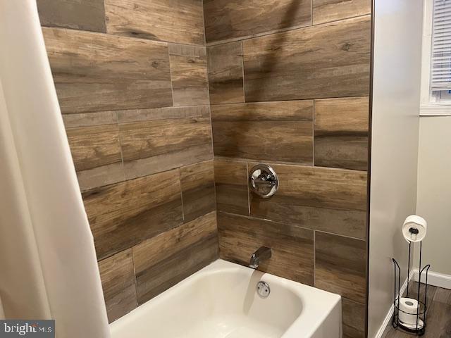 5221 North 8th Street Philadelphia, PA 19120 - Photo 11 of 13 a bathroom with a sink and shower