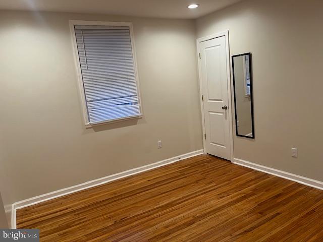 5221 North 8th Street Philadelphia, PA 19120 - Photo 6 of 13 an empty room with wooden floor and closet