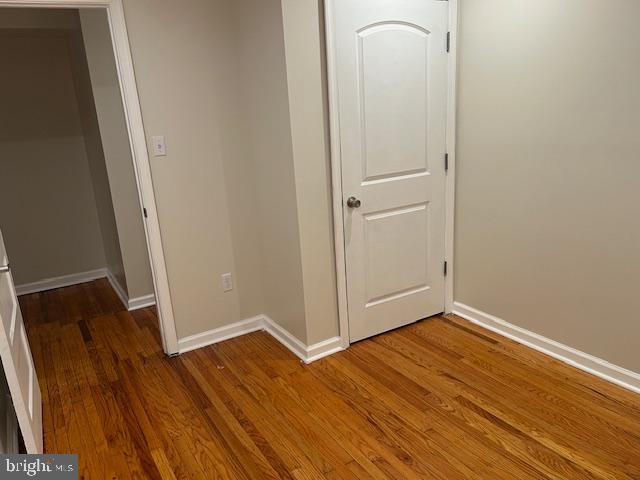 5221 North 8th Street Philadelphia, PA 19120 - Photo 8 of 13 an empty room with wooden floor and closet