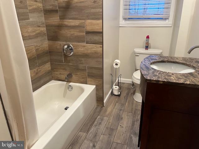 5221 North 8th Street Philadelphia, PA 19120 - Photo 9 of 13 a bathroom with a granite countertop sink a mirror and a bathtub
