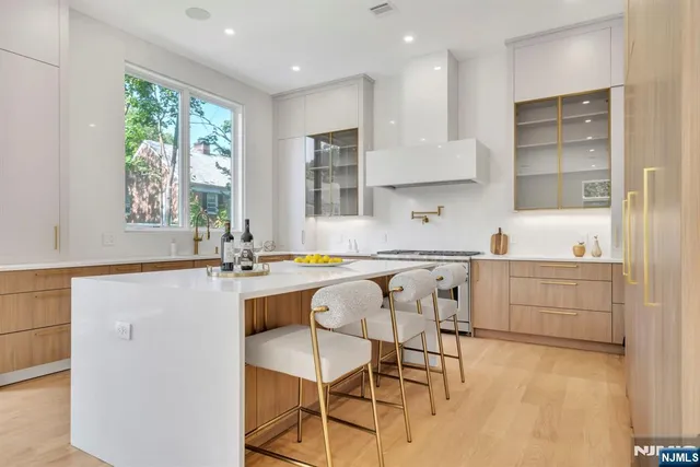 a kitchen with a sink cabinets and window