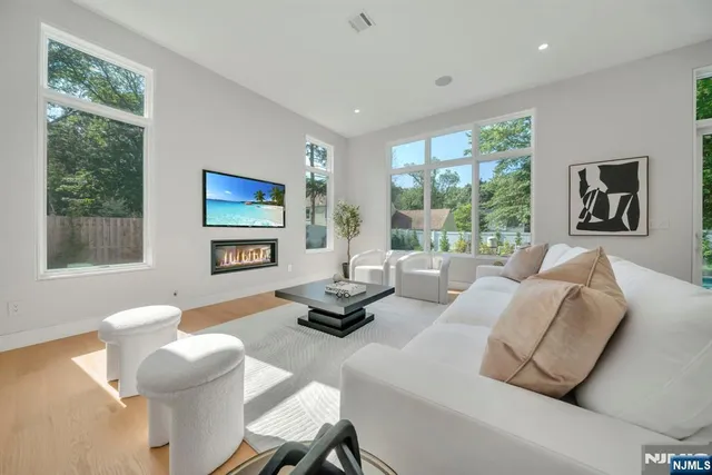 a view of an entryway with wooden floor and windows