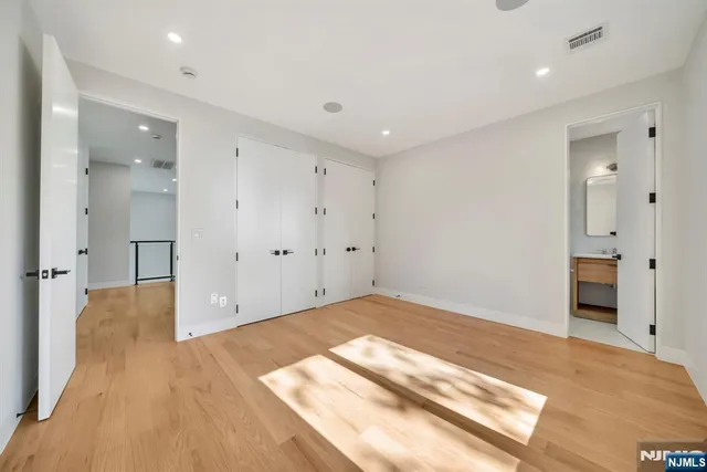 a bathroom with a sink toilet a mirror and shower