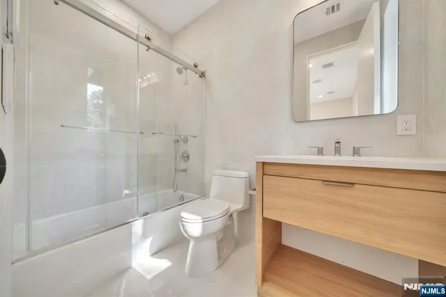 a utility room with sink dryer and washer