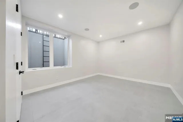 a view of a fountain in front of a house