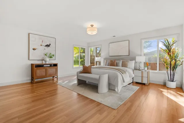 a bedroom with a bed and a couch