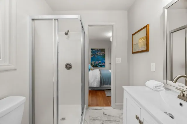 a bathroom with a sink toilet and shower