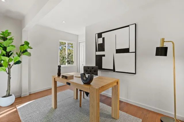 a workspace with furniture and window