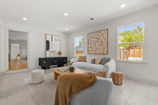 a living room with furniture and a table