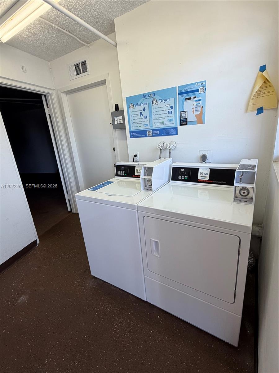 4043 Cornwall C, Unit 4043 Boca Raton, FL 33434 - Photo 13 of 16 a utility room with dryer and washer
