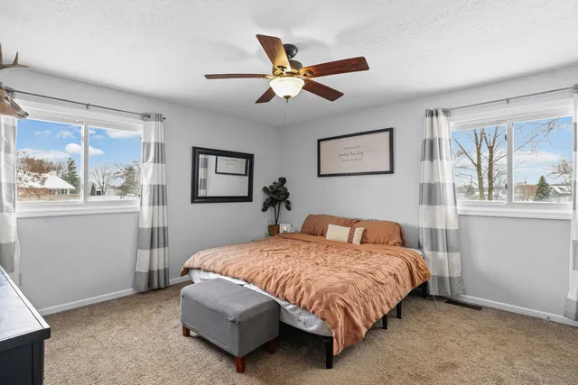 a bedroom with a bed and window