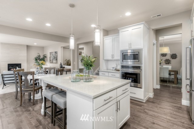 23226 7th Drive Southeast Bothell, WA 98021 - Photo 11 of 24 a kitchen with a sink stove and refrigerator