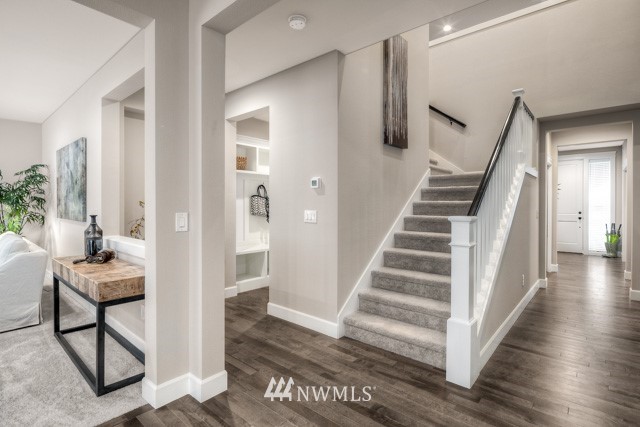 23226 7th Drive Southeast Bothell, WA 98021 - Photo 4 of 24 a view of a hallway with wooden floor and staircase