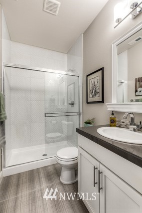 23226 7th Drive Southeast Bothell, WA 98021 - Photo 5 of 24 a bathroom with a granite countertop sink toilet and shower