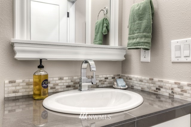 23226 7th Drive Southeast Bothell, WA 98021 - Photo 6 of 24 a bathroom with a sink and a mirror