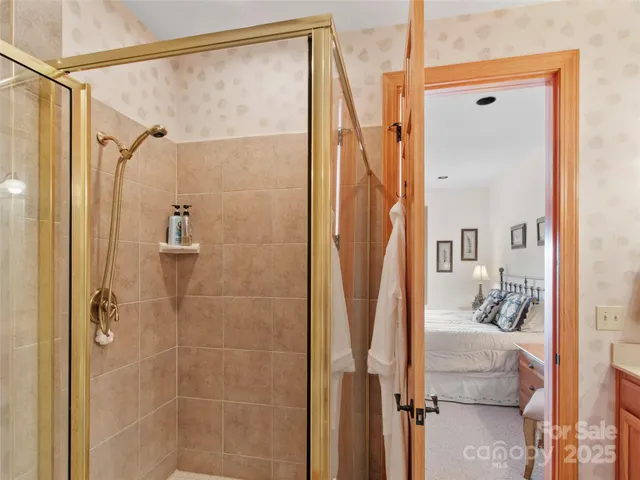 a bathroom with a shower and a sink