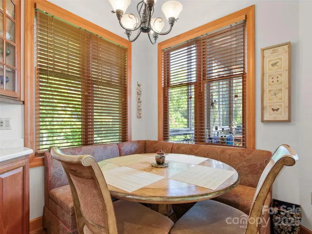a view of a dining room with furniture and windows