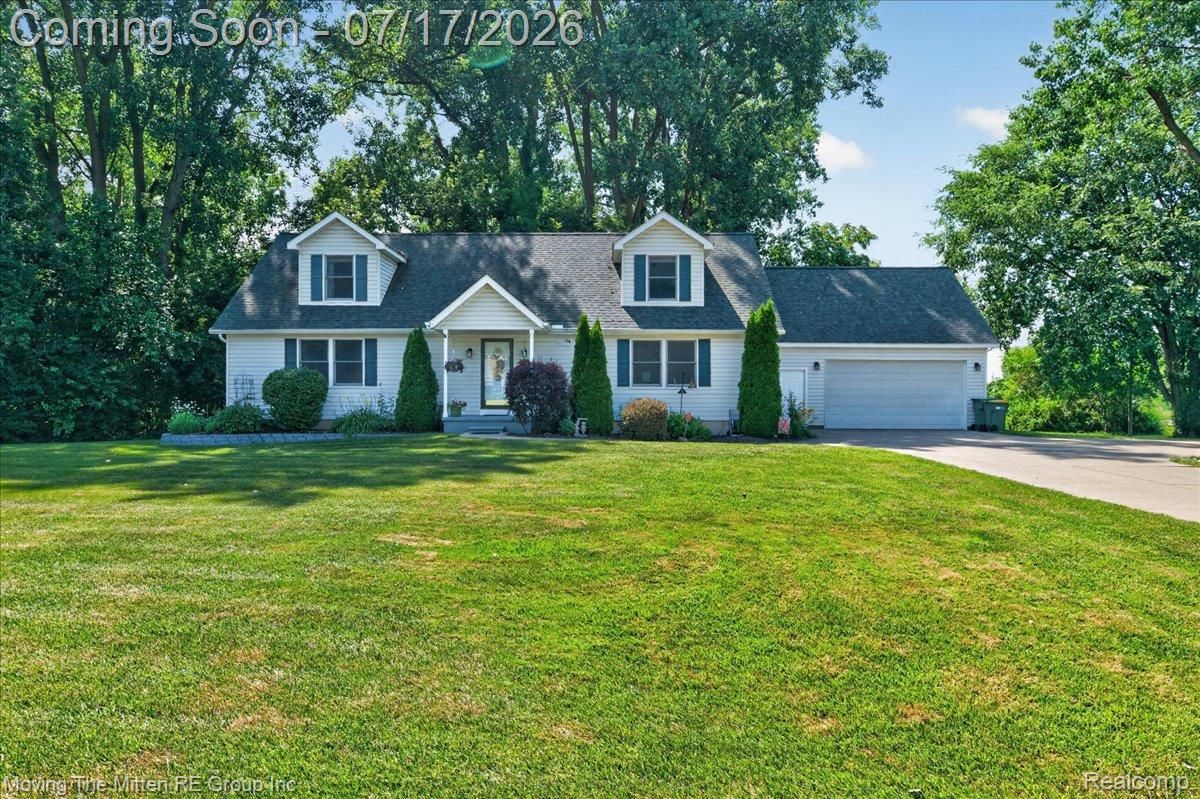 40162 Alden Road Belleville, MI 48111 - Photo 52 of 67 White siding exterior with dark blue window shutters