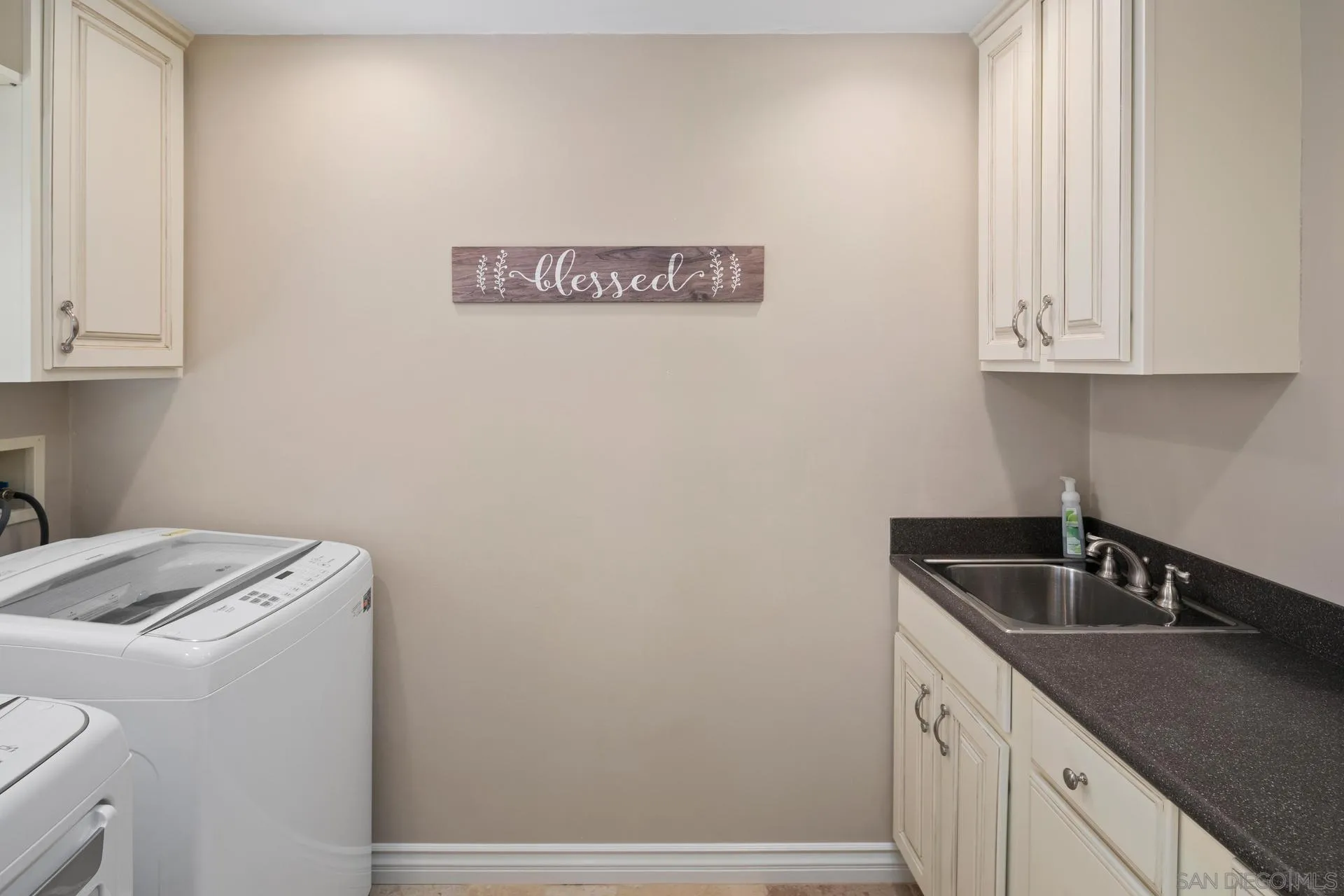 1100 Pine Street Coronado, CA 92118 - Photo 11 of 57 a utility room with sink dryer and washer