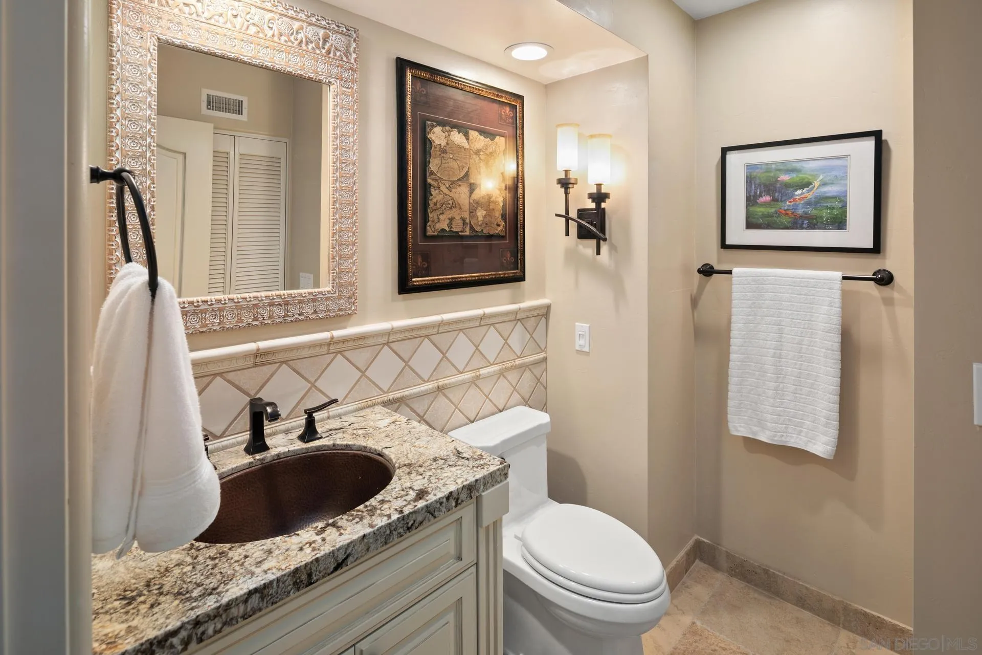 1100 Pine Street Coronado, CA 92118 - Photo 13 of 57 a bathroom with a granite countertop toilet sink and mirror