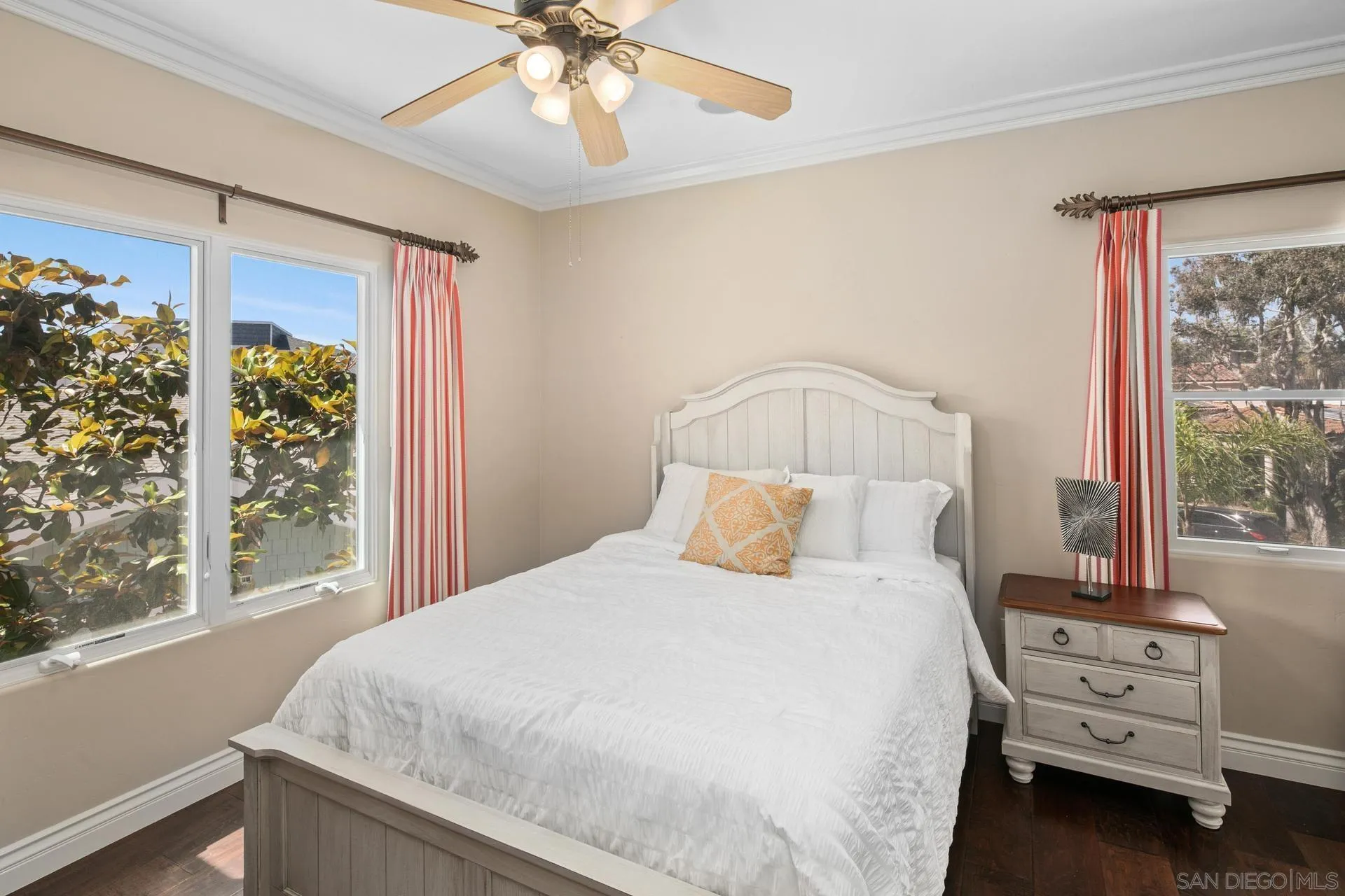 1100 Pine Street Coronado, CA 92118 - Photo 27 of 57 a bedroom with a bed and a chandelier