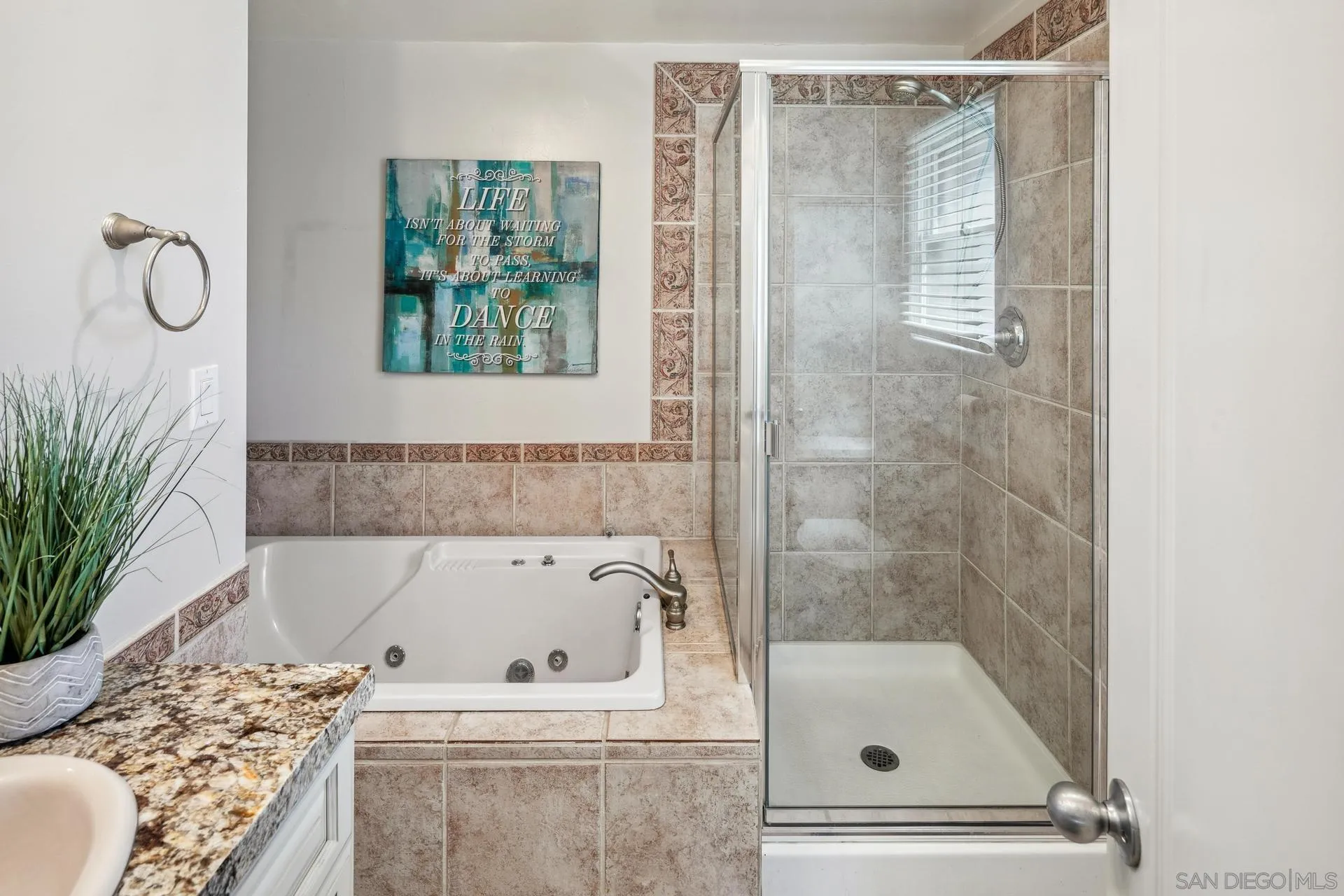 1100 Pine Street Coronado, CA 92118 - Photo 31 of 57 a bathroom with a tub sink and mirror