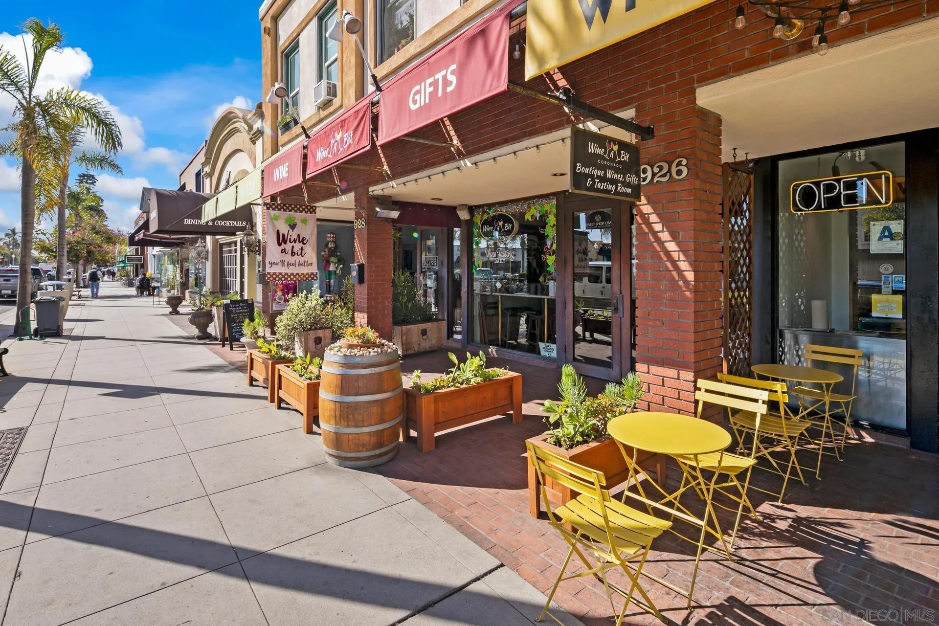 1100 Pine Street Coronado, CA 92118 - Photo 45 of 57 a view of the patio with dining table and chairs under an umbrella