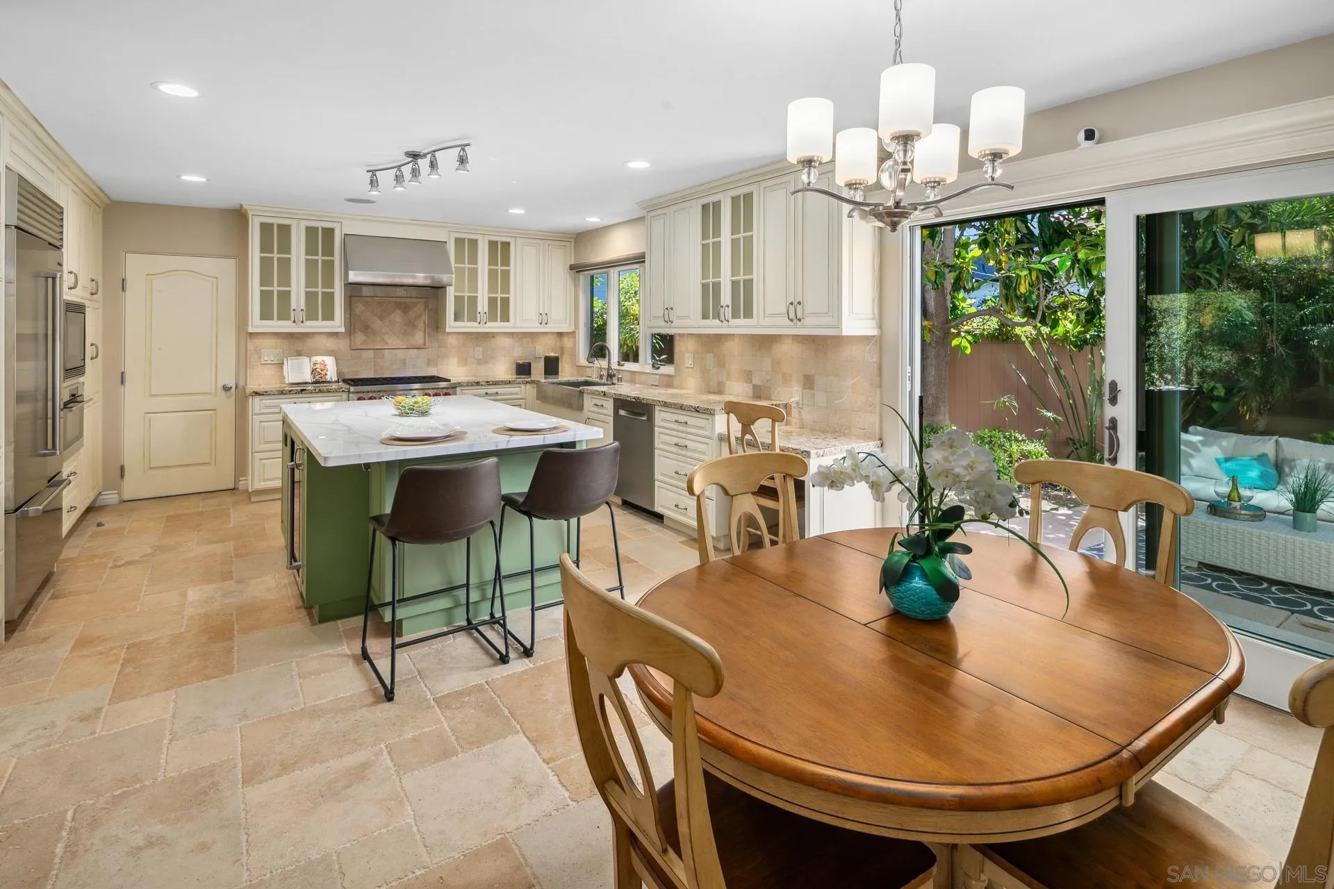 1100 Pine Street Coronado, CA 92118 - Photo 7 of 57 a view of a dining room with furniture wooden floor and chandelier