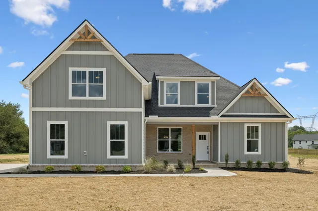 a front view of a house with yard