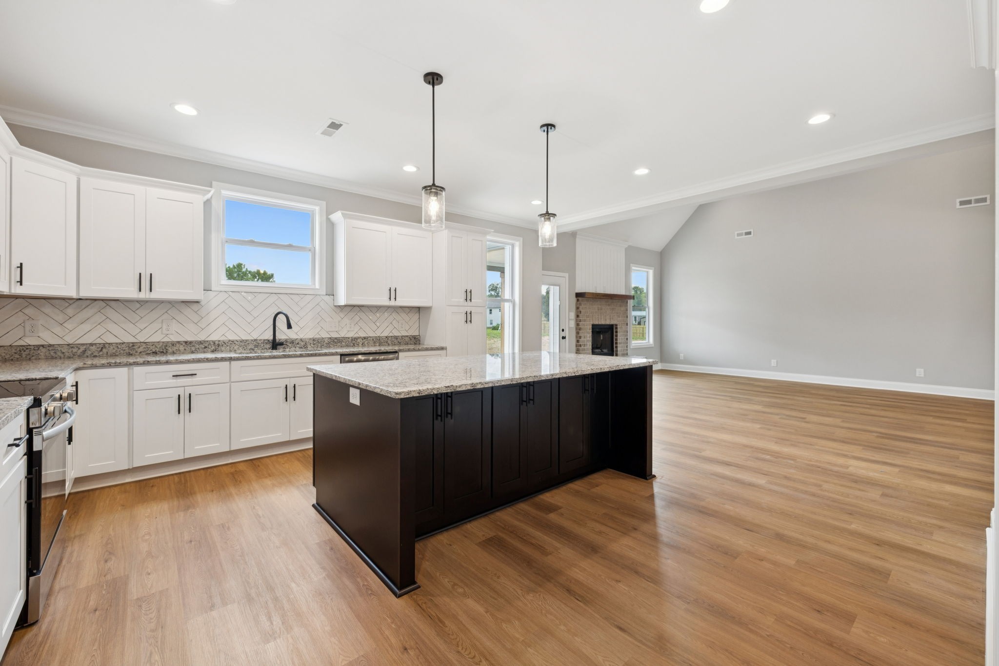 28 Faith Lane Lebanon, TN 37087 - Photo 14 of 53 a large kitchen with granite countertop a large counter top a sink stainless steel appliances and cabinets