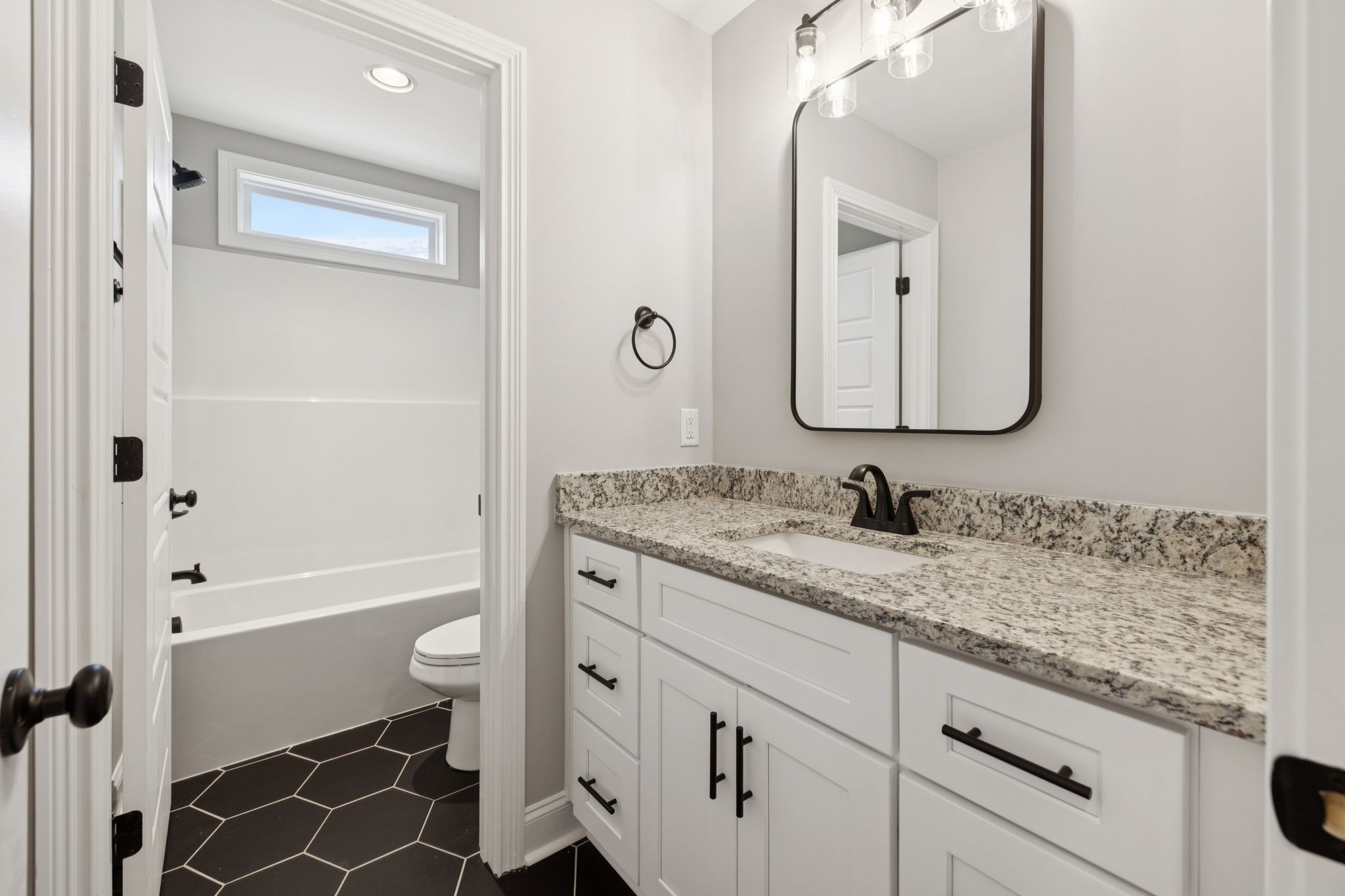 28 Faith Lane Lebanon, TN 37087 - Photo 36 of 53 a bathroom with a granite countertop sink a toilet and a mirror
