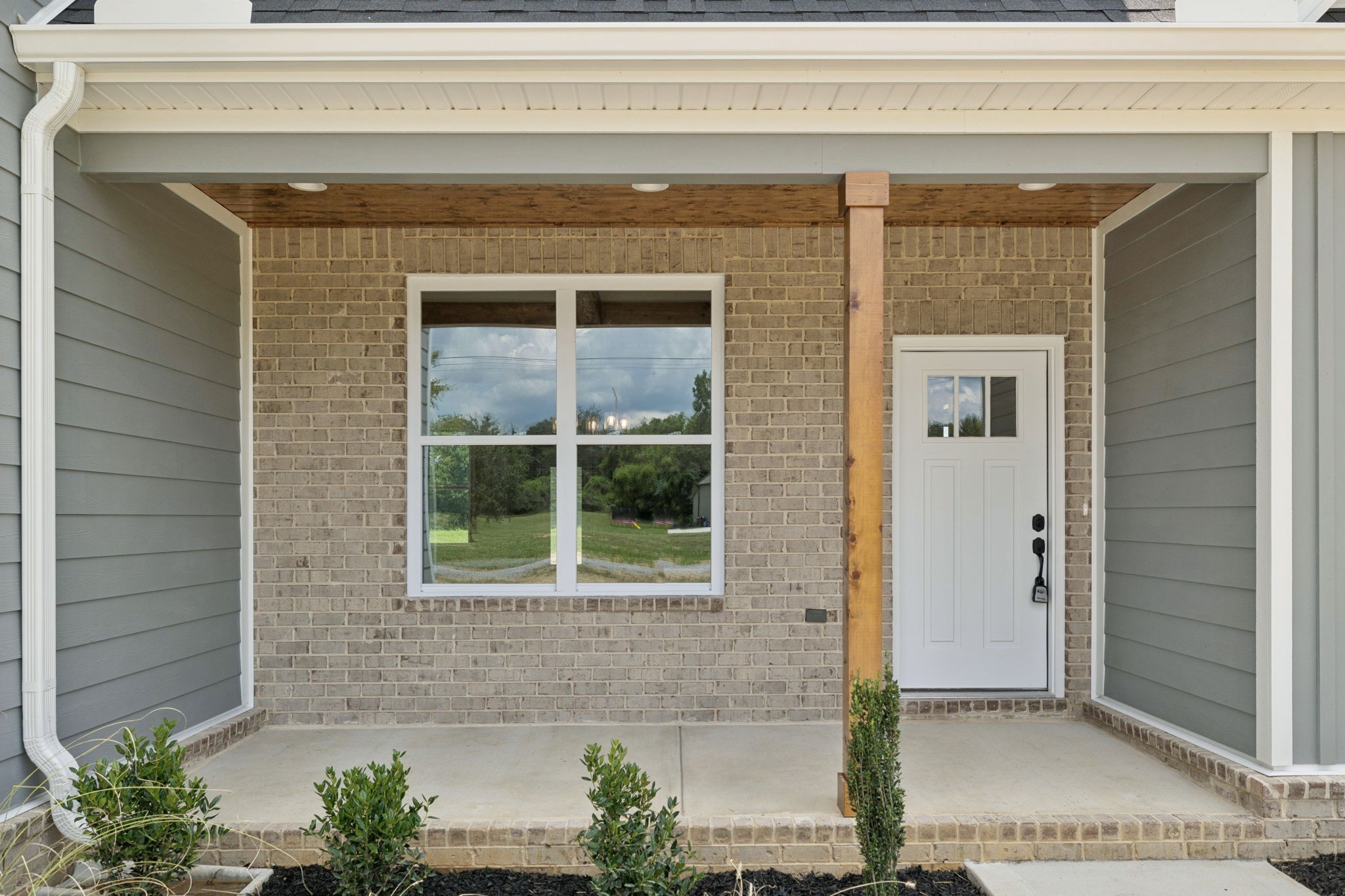 28 Faith Lane Lebanon, TN 37087 - Photo 4 of 53 a front view of a house with a potted plant and a window