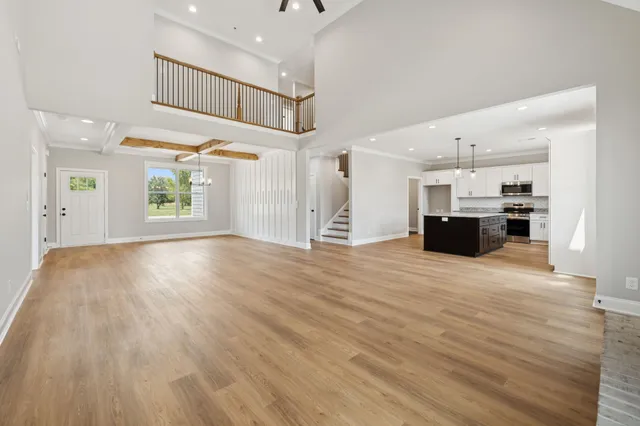 a view of a kitchen with a sink and a stove top oven